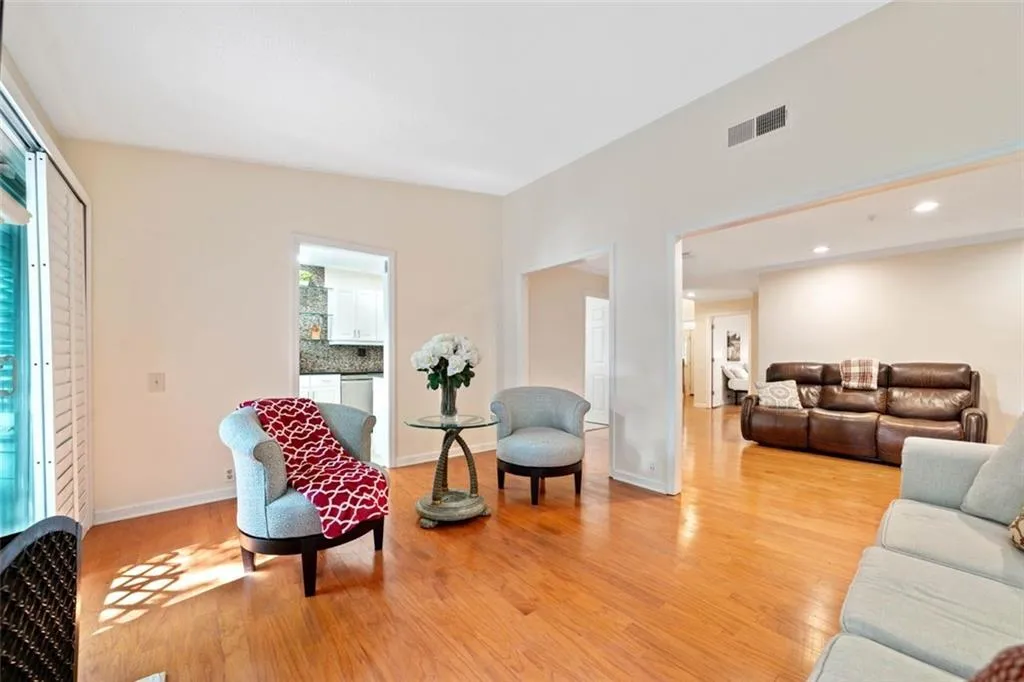 Living room with light hardwood / wood-style flooring