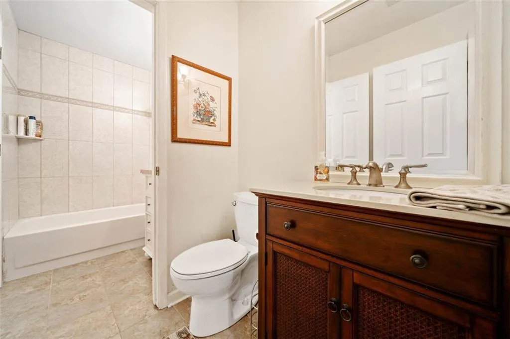Bathroom with tile patterned floors, vanity, and toilet