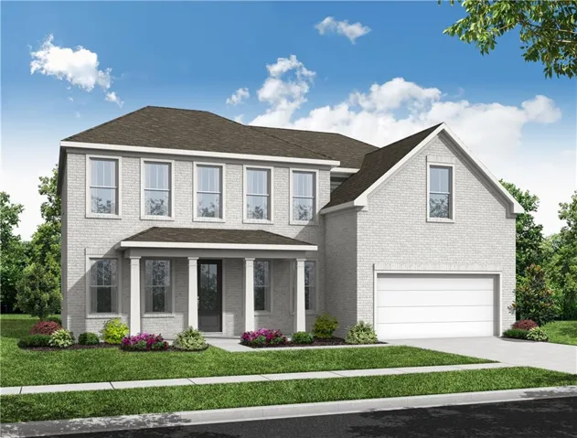 Two-story brick exterior, covered front porch with columns, attached two-car garage, multiple windows, and landscaped front yard