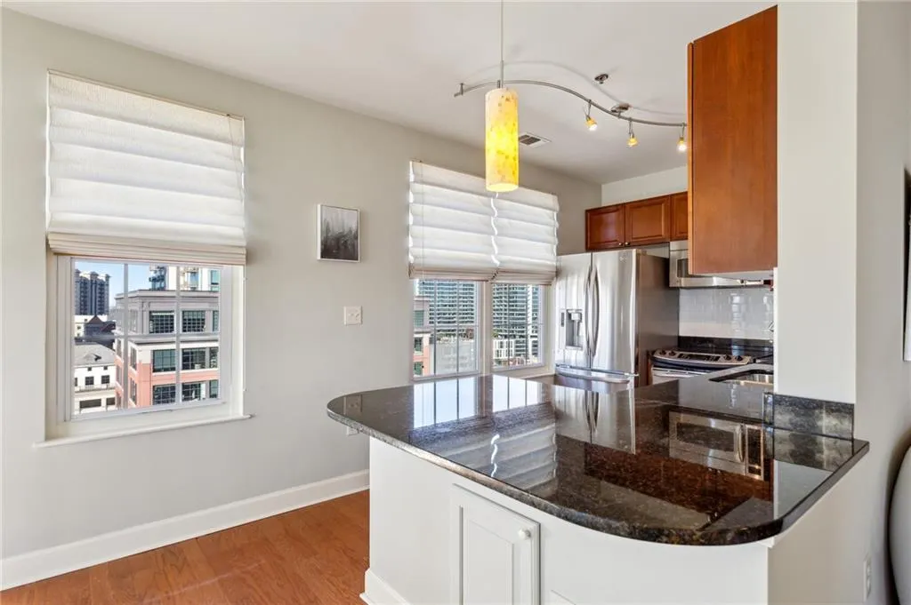With stainless appliances and granite counters