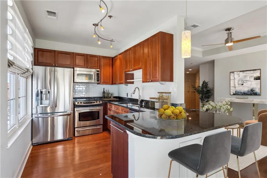 Light and bright kitchen opens to living room
