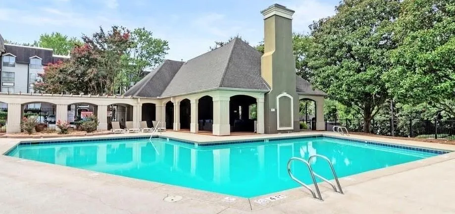 Community pool featuring a patio area