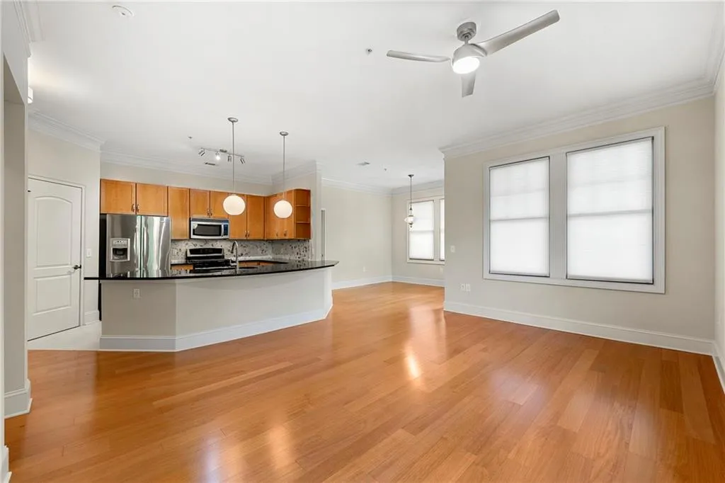 Bright/Open concept living room and dining room with flawless floors and freshly painted walls.