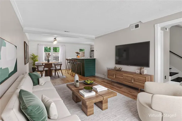 Virtually staged, showing how large this living/dining room is.   Great size and flow for entertaining also.