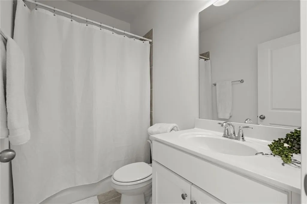 Full bathroom featuring vanity and tile patterned floors