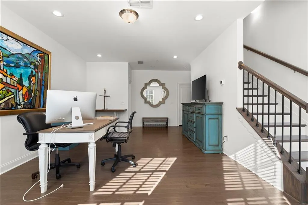 Office area featuring recessed lighting and dark wood-style flooring
