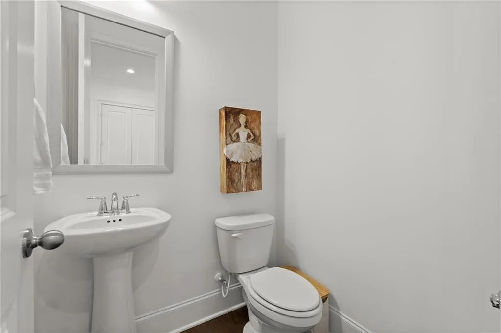 Bathroom featuring recessed lighting and wood finished floors
