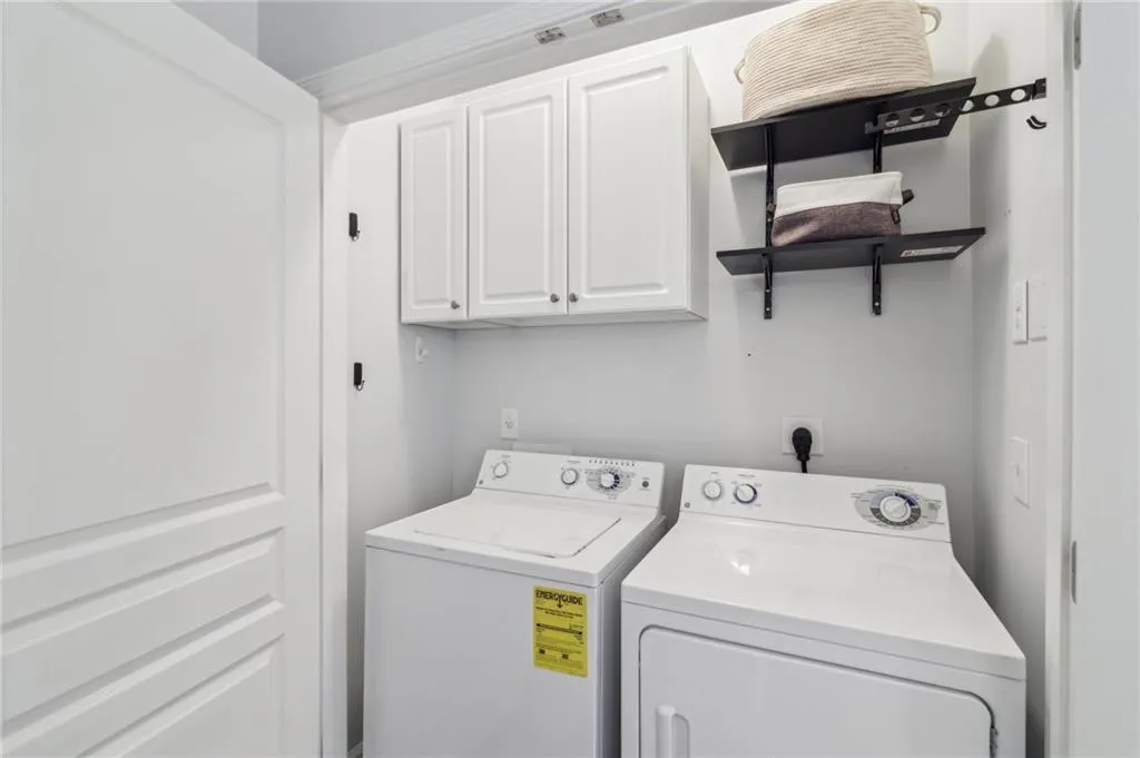 Laundry room featuring cabinet space and washer and dryer