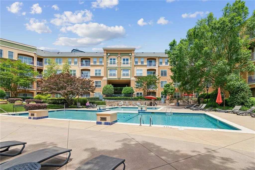 Community pool with a patio area