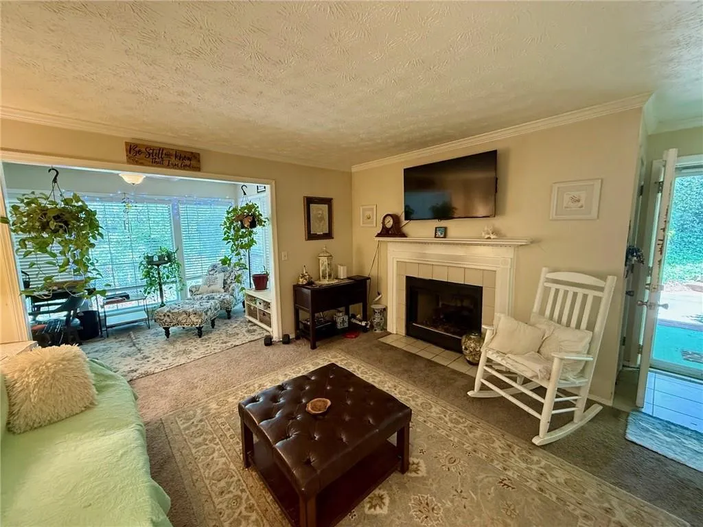 Spacious living room w gas fireplace and bonus room that can be used for an office or sun room
