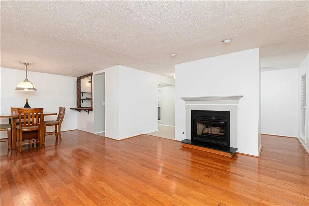 Great room with real hardwoods is very spacious. Gas fireplace
