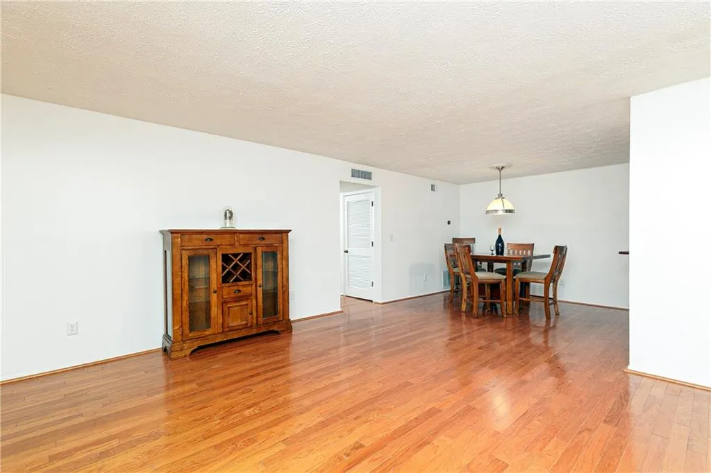 Open floor plan leads into dining room and custom bar