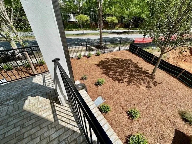 Large green space on the side of the home