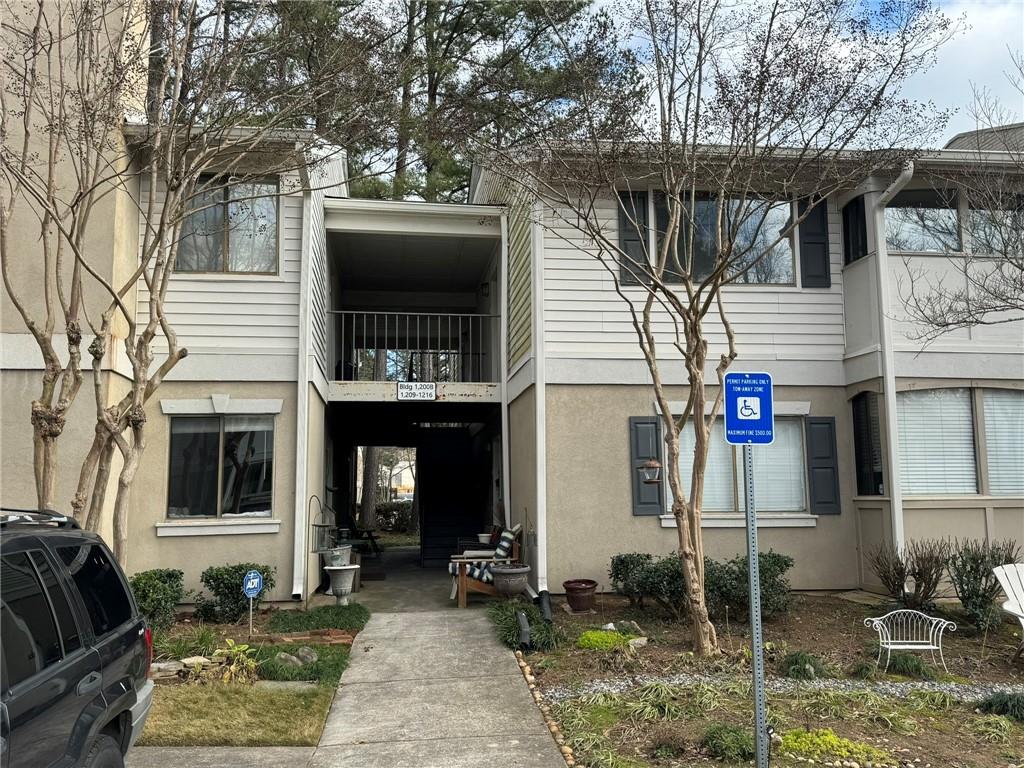 Townhome / multi-family property with a balcony