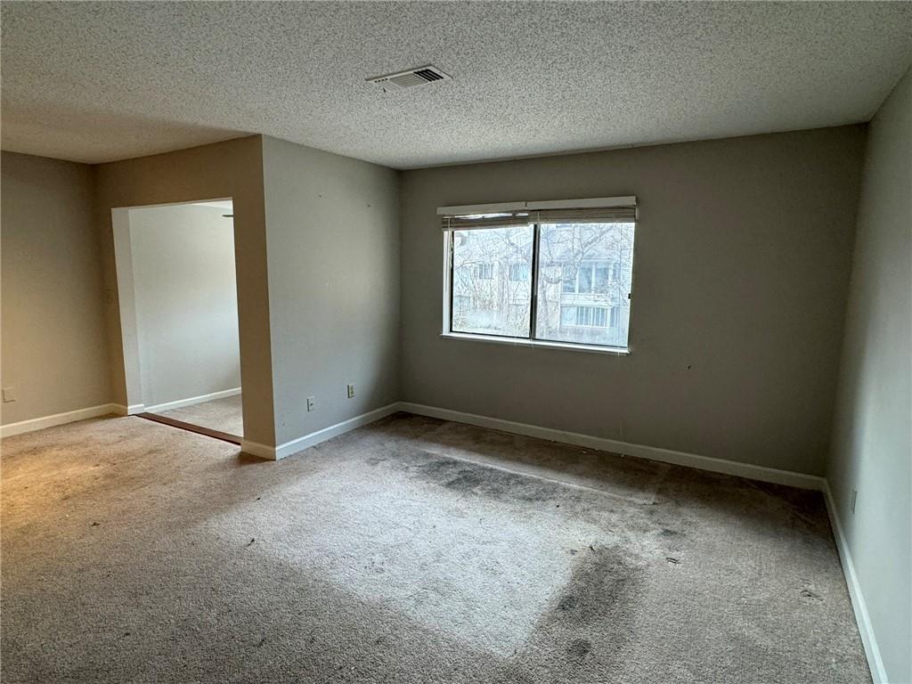 Large living room open to dining and sunroom