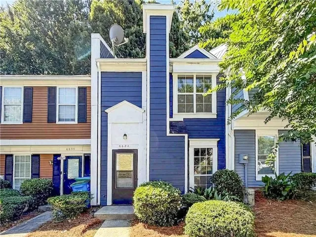 Blue siding exterior with white trim details