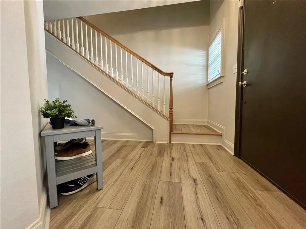 Entryway with light hardwood / wood-style flooring