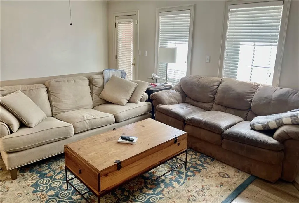 Living room with light wood-type flooring