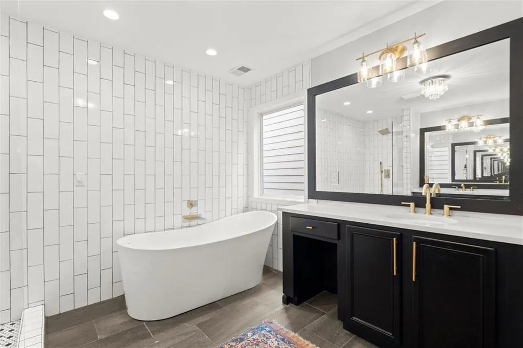 Stunning bathroom renovation with freestanding tub.