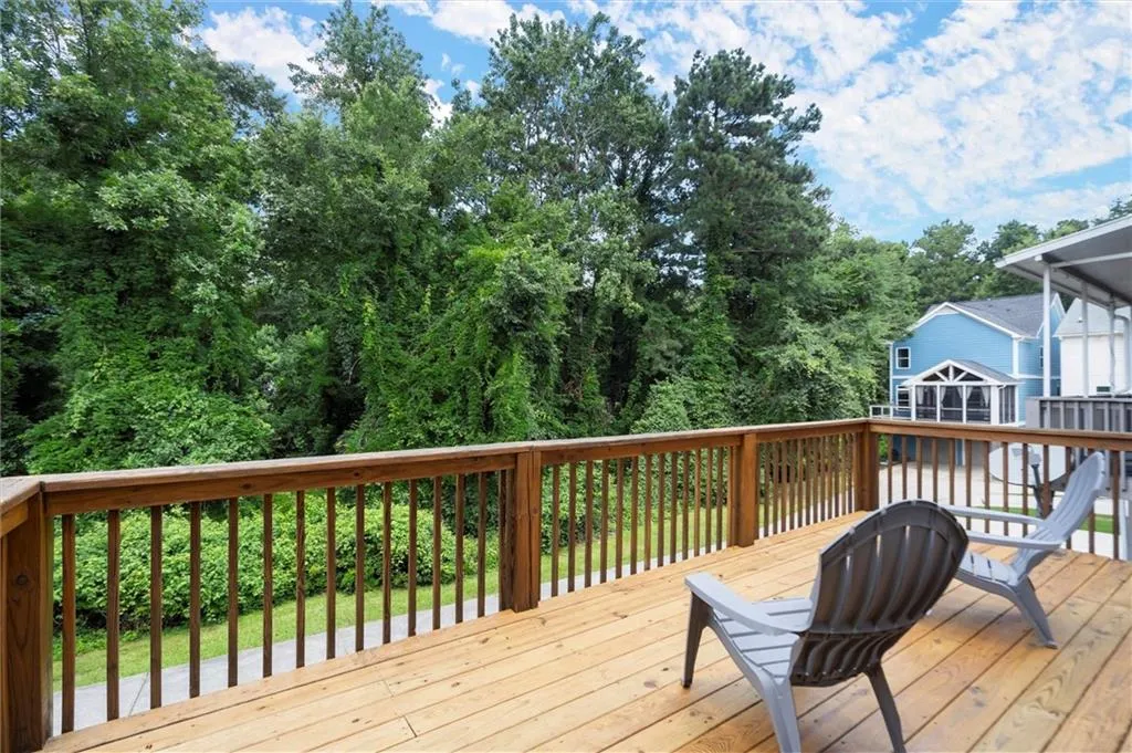Back Deck overlooks wooded grove.