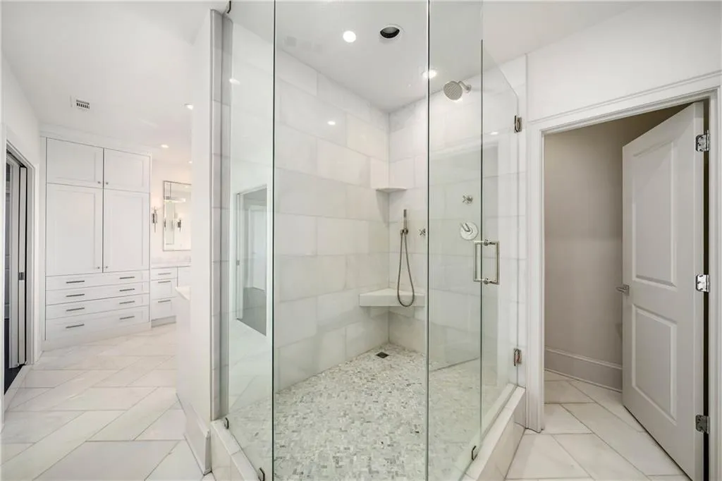 Bathroom with a stall shower, recessed lighting, and vanity