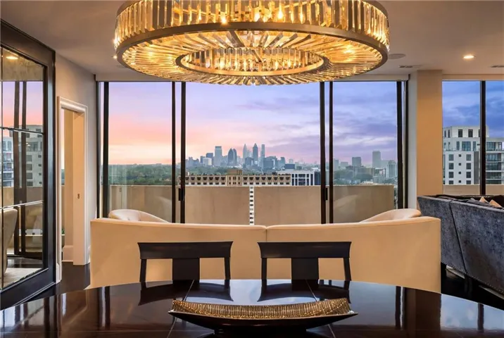 Dining space with a view of skyline and expansive windows