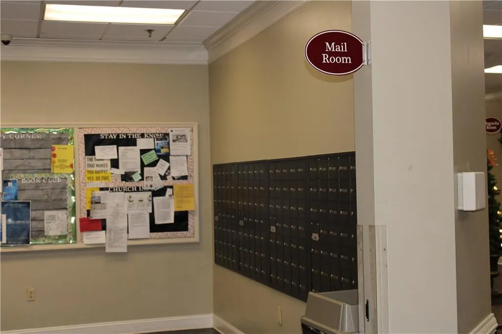 View of property's community with mail area and ornamental molding View of property's community with mail area and ornamental molding