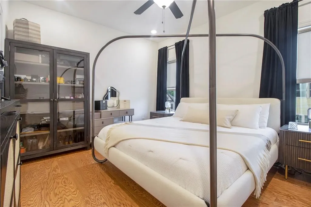 Bedroom featuring wood finished floors and recessed lighting