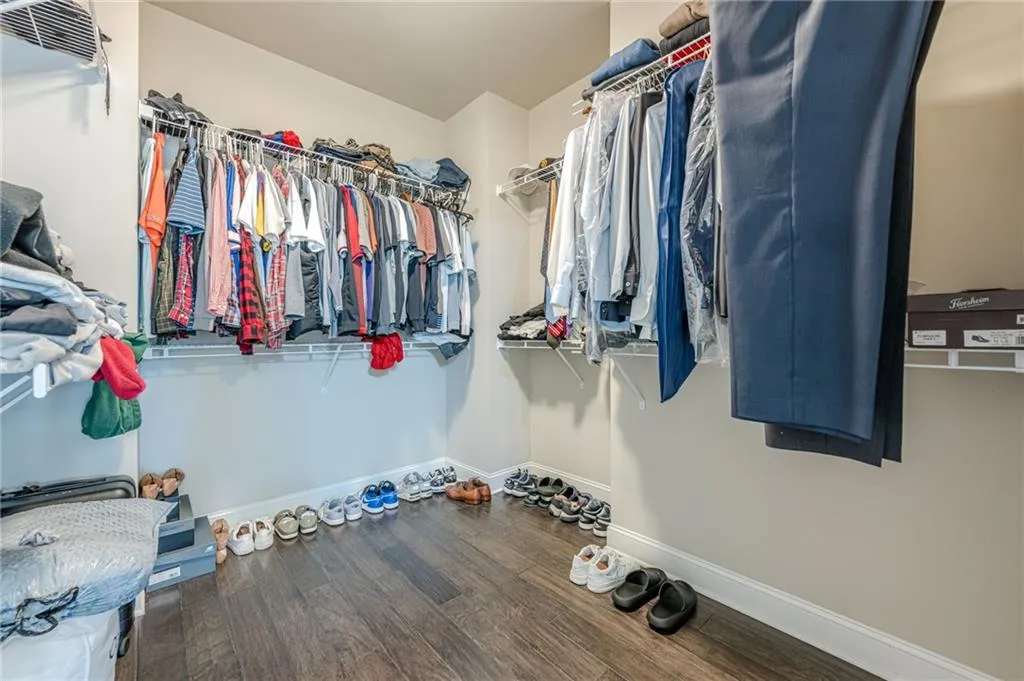 Primary bedroom walk-in closet