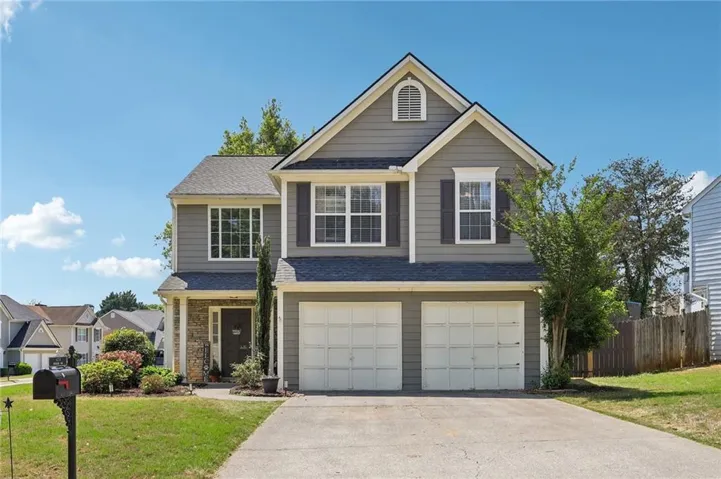 Two-story residence featuring gray siding and white trim