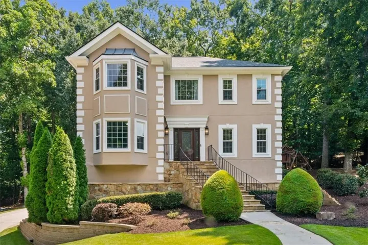 Beautiful Alpharetta home with welcoming curb appeal and a long, level driveway