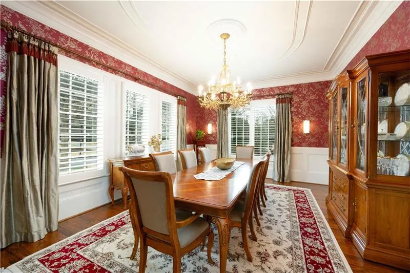 Dining area with dark hardwood / wood-style flooring and a chandelier