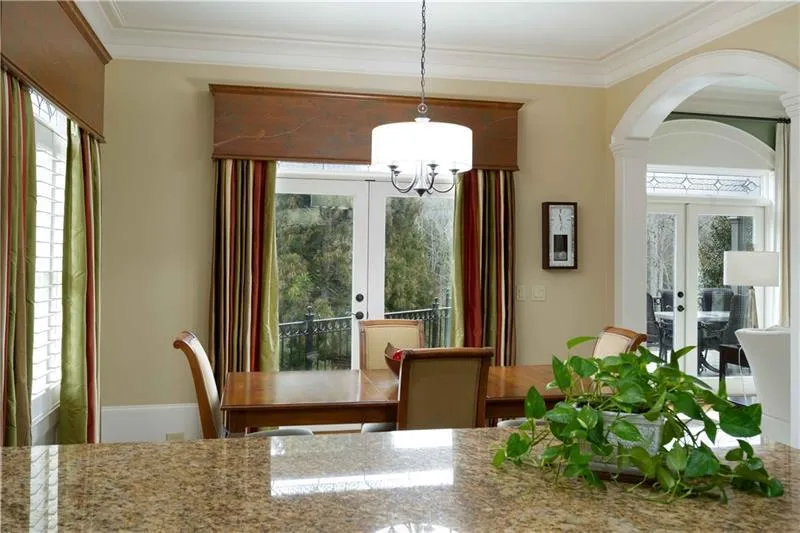 Unfurnished dining area with plenty of natural light and french doors