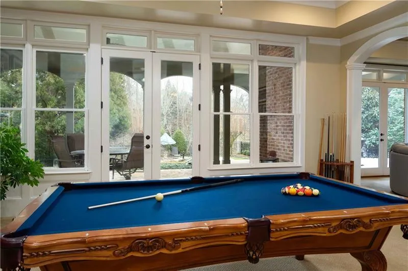Rec room with french doors, carpet floors, and billiards