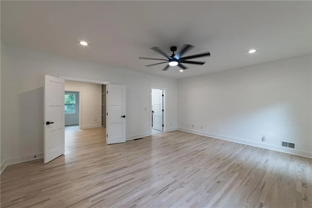 Unfurnished bedroom with recessed lighting, light wood-type flooring, and a ceiling fan