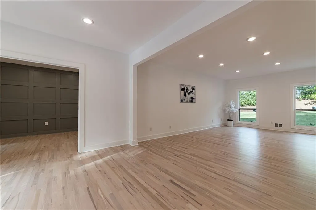 Unfurnished living room featuring recessed lighting and light wood-style flooring