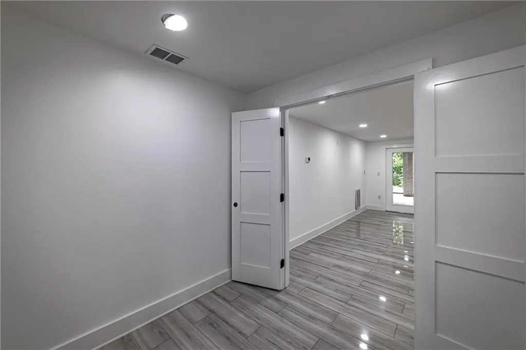 Empty room with recessed lighting and light wood finished floors