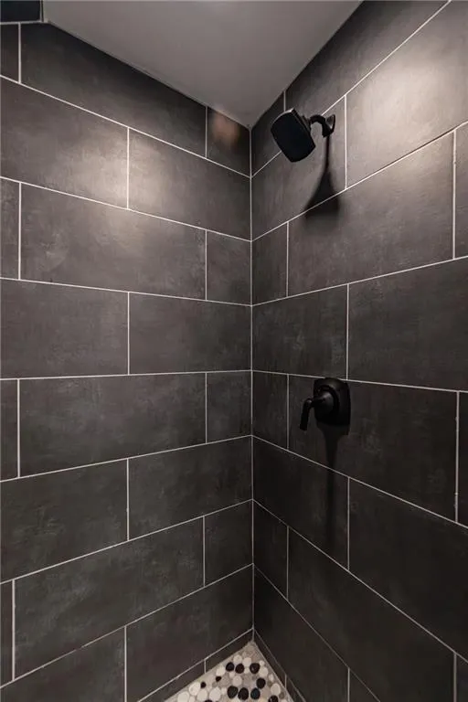 Bathroom with tiled shower