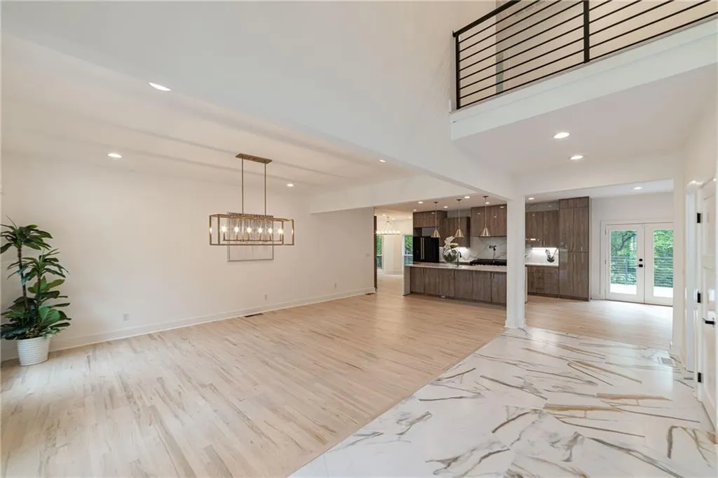 Unfurnished living room with french doors, recessed lighting, and light wood-type flooring