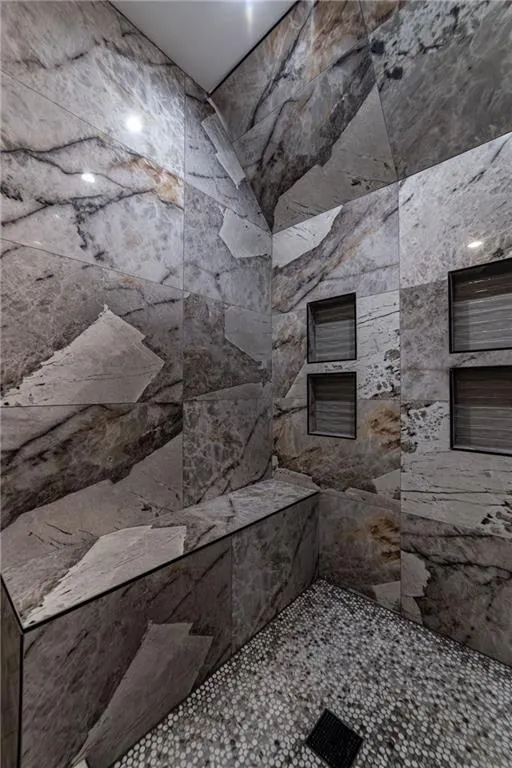 Full bath with tiled shower