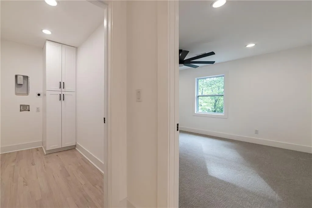 Corridor featuring recessed lighting and light wood finished floors