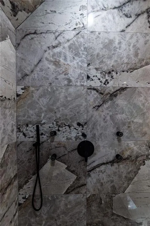 Bathroom view of a tile shower