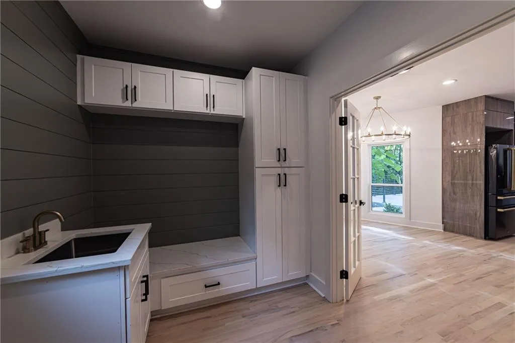 Mudroom with recessed lighting, a chandelier, and light wood-style floors