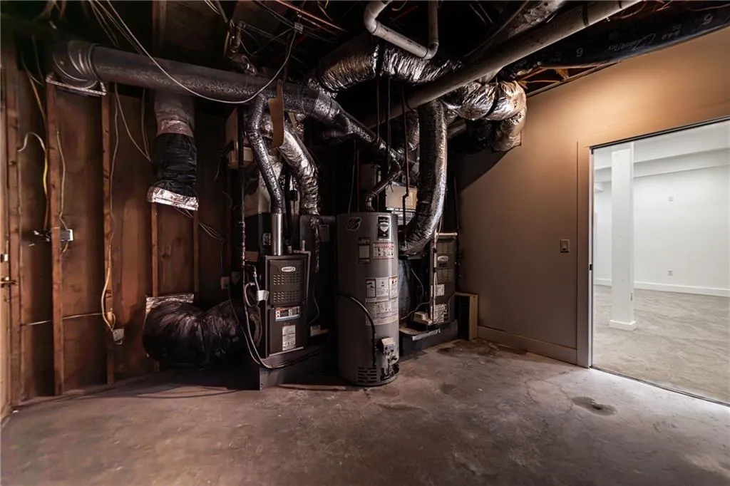 Utility room featuring gas water heater