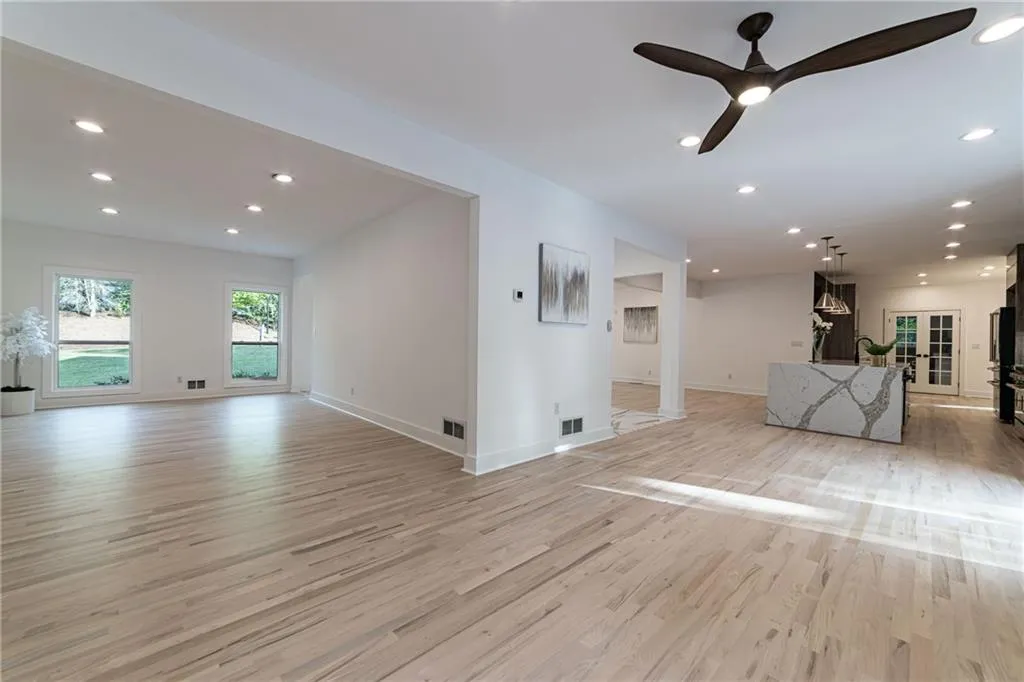 Unfurnished living room with recessed lighting, light wood-type flooring, and ceiling fan