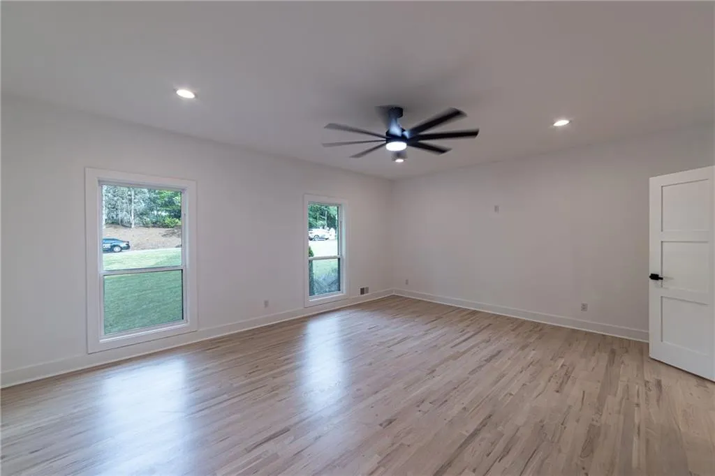 Unfurnished room featuring light wood-style flooring, recessed lighting, and a ceiling fan