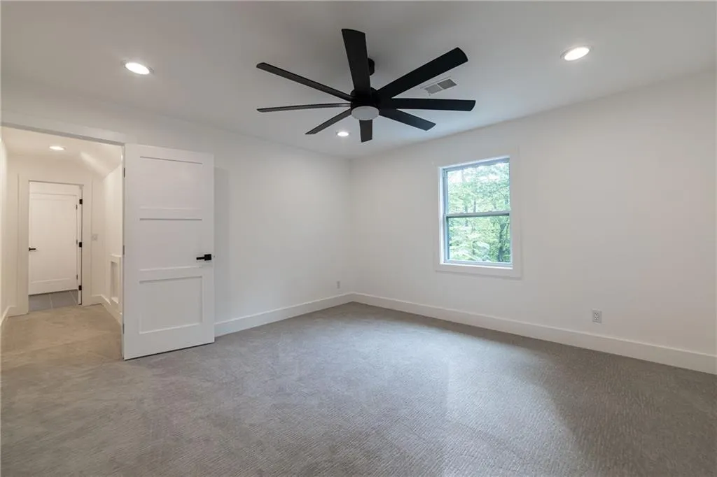 Unfurnished room featuring light carpet, recessed lighting, and a ceiling fan