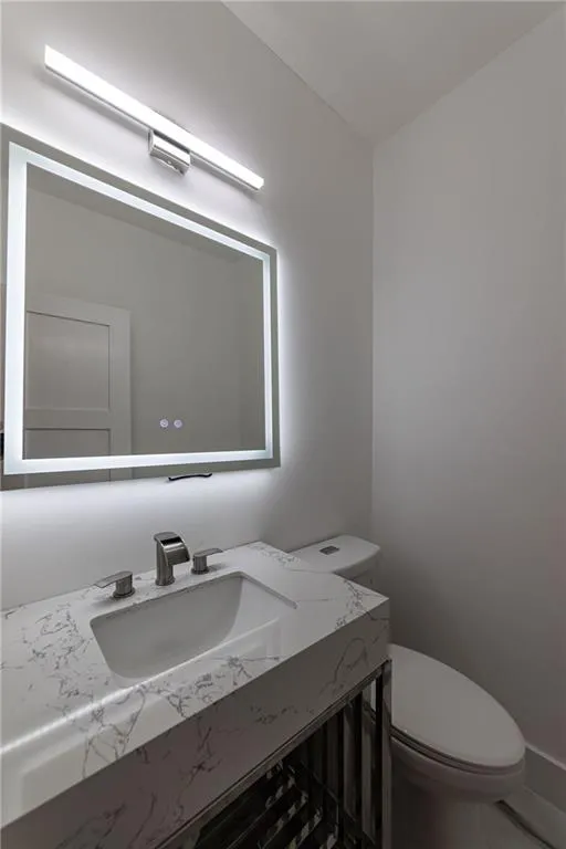 Bathroom with vanity and toilet