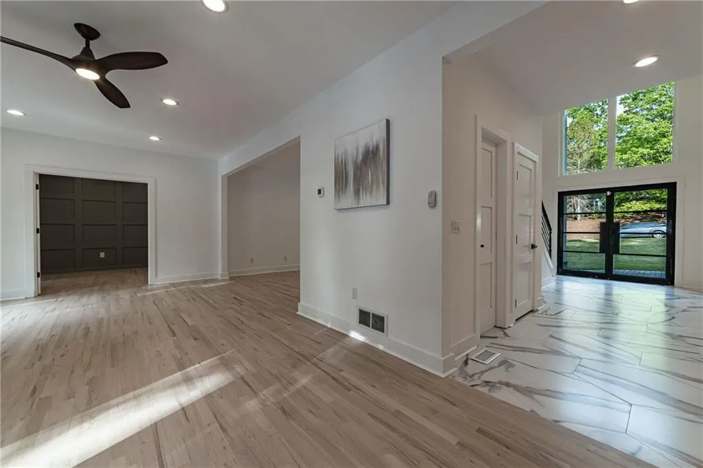 Unfurnished living room featuring recessed lighting, french doors, light wood-type flooring, and ceiling fan