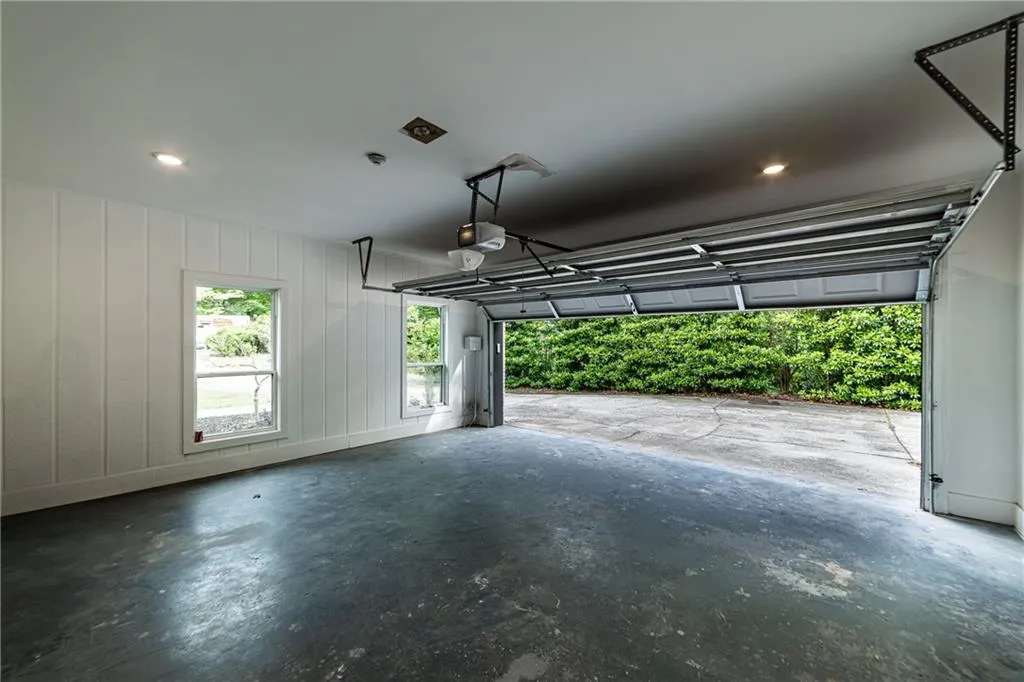 Garage featuring recessed lighting and a garage door opener